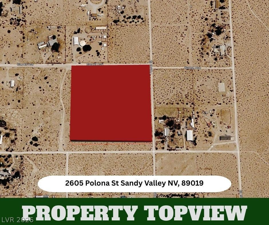 A spacious desert parcel outlined from above highlights the expansive layout of the surrounding area.