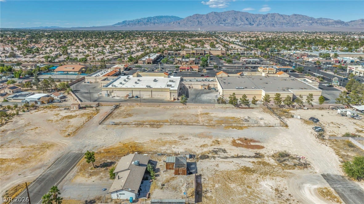 Dramatic mountain vistas frame this sprawling property with expansive territorial potential.