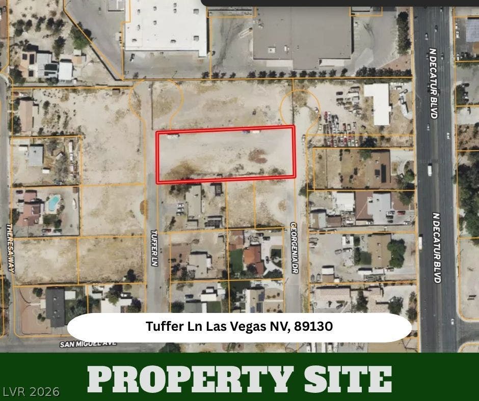 An aerial overview highlights the boundary lines of this level property lot.