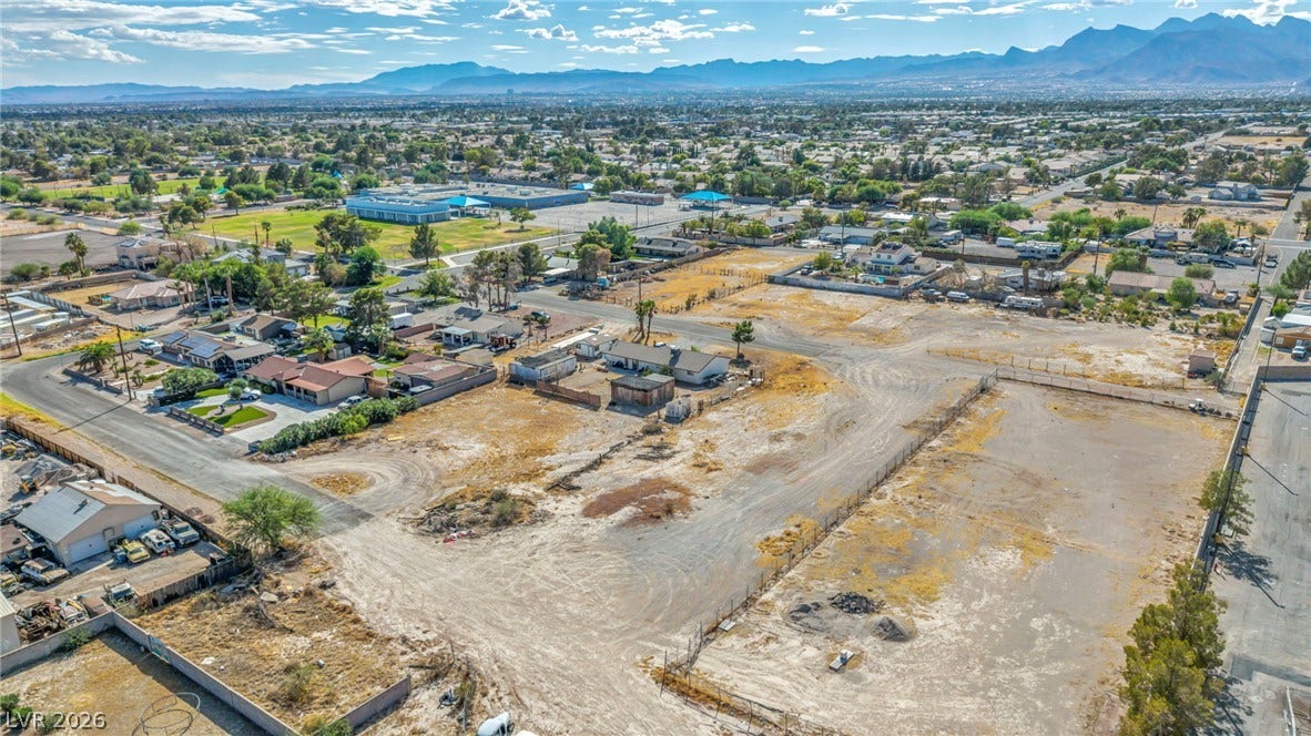 Panoramic mountain and valley vistas frame this expansive parcel of desert land.