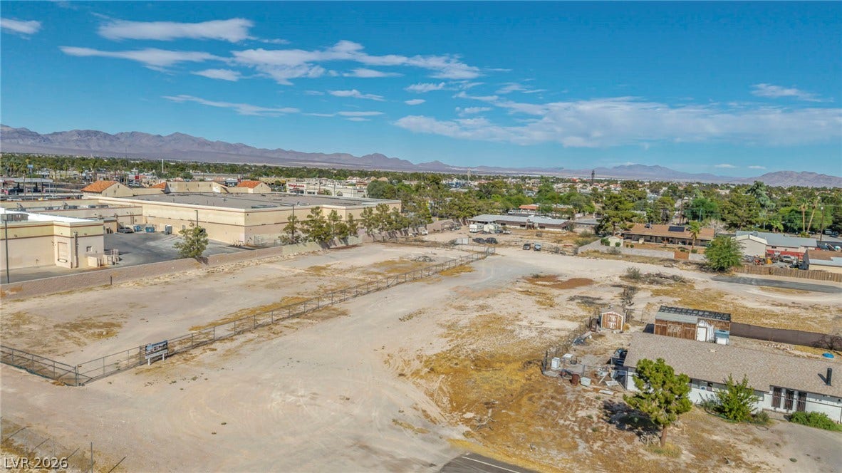 Distant mountains frame this open lot with boundless potential for development.
