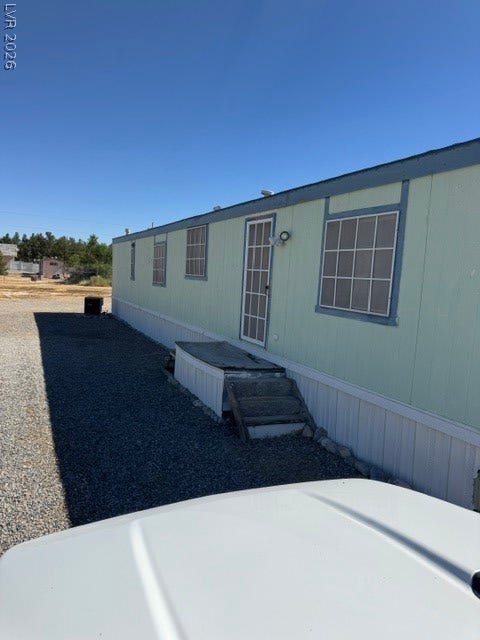 Pahrump, NV 89048 A side entrance with steps leads along the exterior of this single-level home.