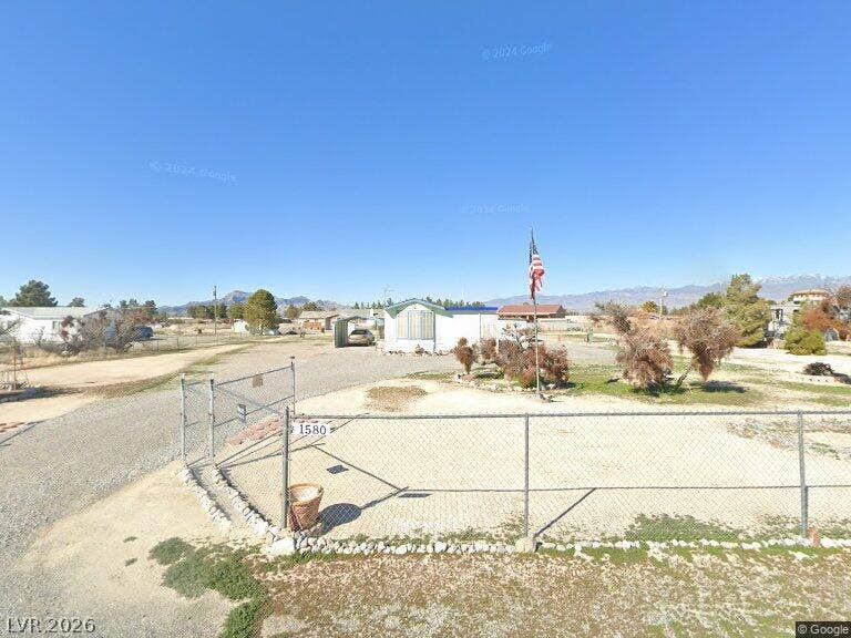 Pahrump, NV 89048 A spacious lot features a gated perimeter and sweeping mountain views in the distance.