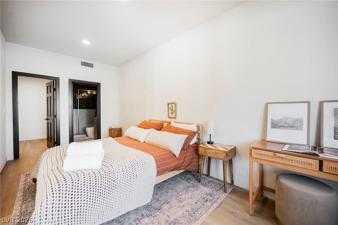 5741 S Pearl Street, Las Vegas, NV 89120 Smooth plaster walls and warm hardwood floors create a serene, minimalist retreat.