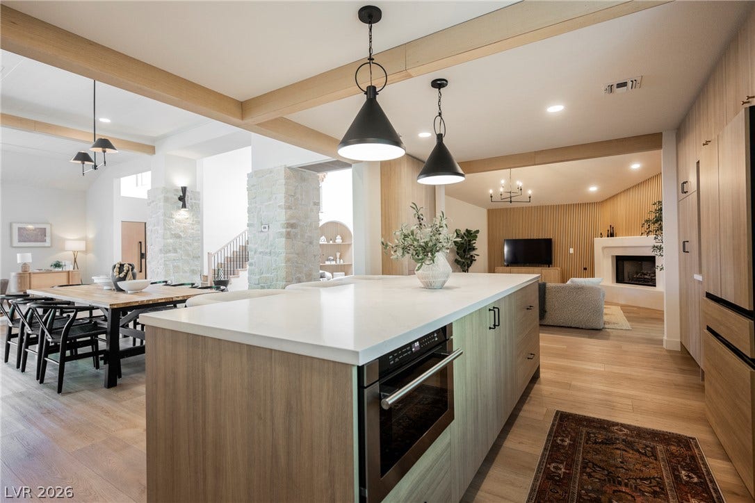 5741 S Pearl Street, Las Vegas, NV 89120 Exquisite wood ceilings and stone columns anchor this expansive open-concept main floor living space.