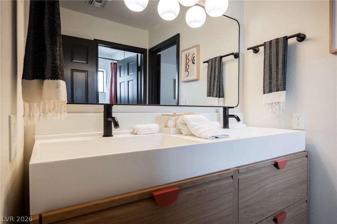5741 S Pearl Street, Las Vegas, NV 89120 A modern double vanity anchors this beautifully updated bathroom space.
