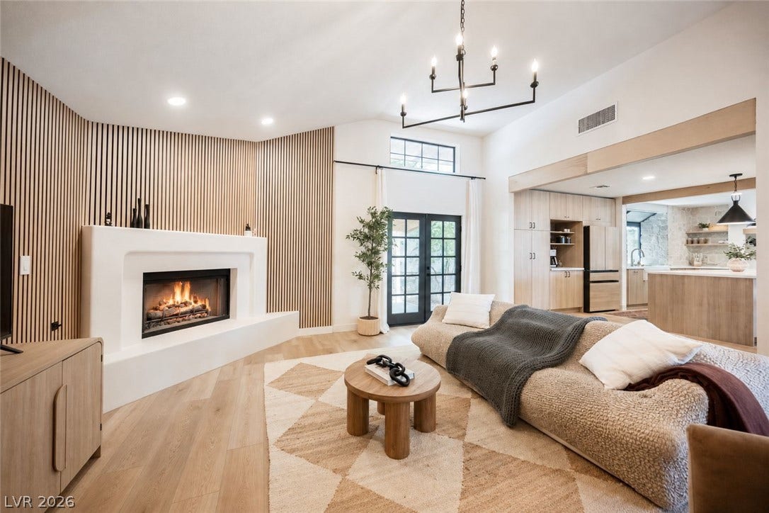 5741 S Pearl Street, Las Vegas, NV 89120 An open floorplan connects the comfortable fireside lounge directly to the sleek modern kitchen.