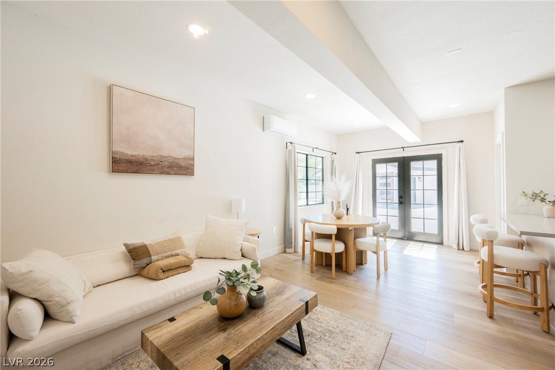 5741 S Pearl Street, Las Vegas, NV 89120 Smooth wood floors anchor this open living area featuring classic French doors.