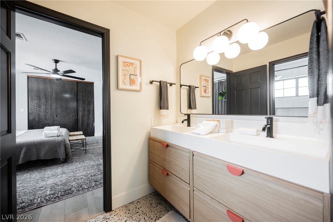 5741 S Pearl Street, Las Vegas, NV 89120 Clean lines and a spacious double vanity define this modern bathroom design.