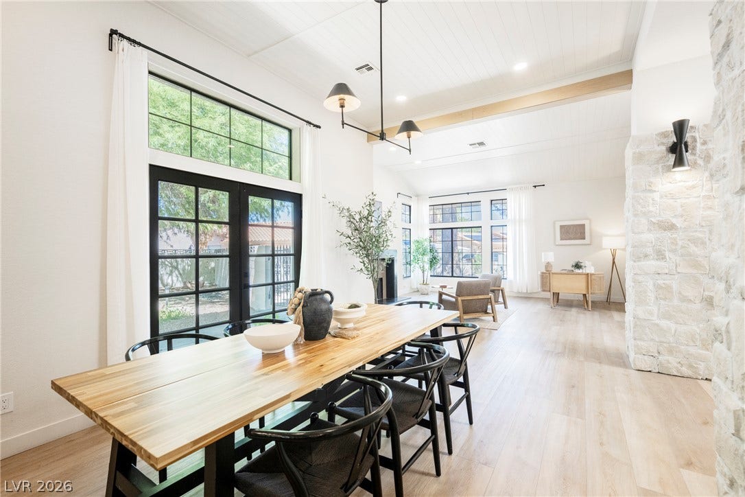 5741 S Pearl Street, Las Vegas, NV 89120 Gleaming wood floors and a soaring beamed ceiling define this spacious, open-concept dining area.