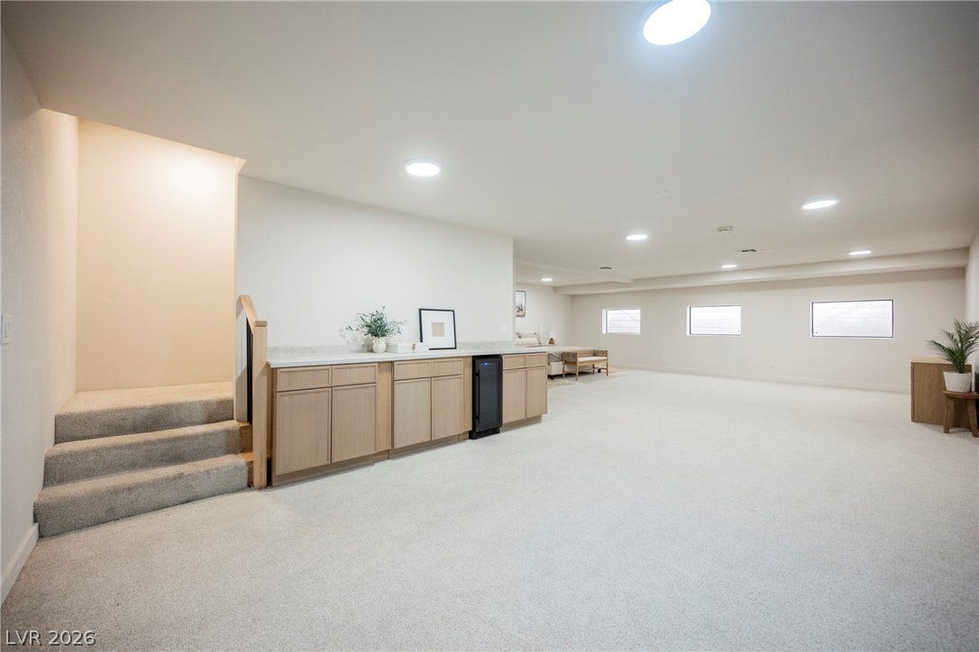 5741 S Pearl Street, Las Vegas, NV 89120 Recessed lighting illuminates this versatile finished lower level with integrated wet bar cabinetry.