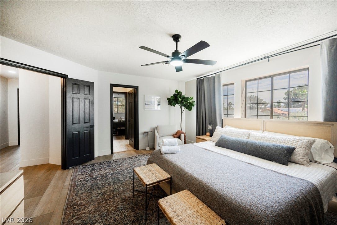 5741 S Pearl Street, Las Vegas, NV 89120 Gleaming hardwood floors and classic multi-pane windows anchor this restful bedroom space.