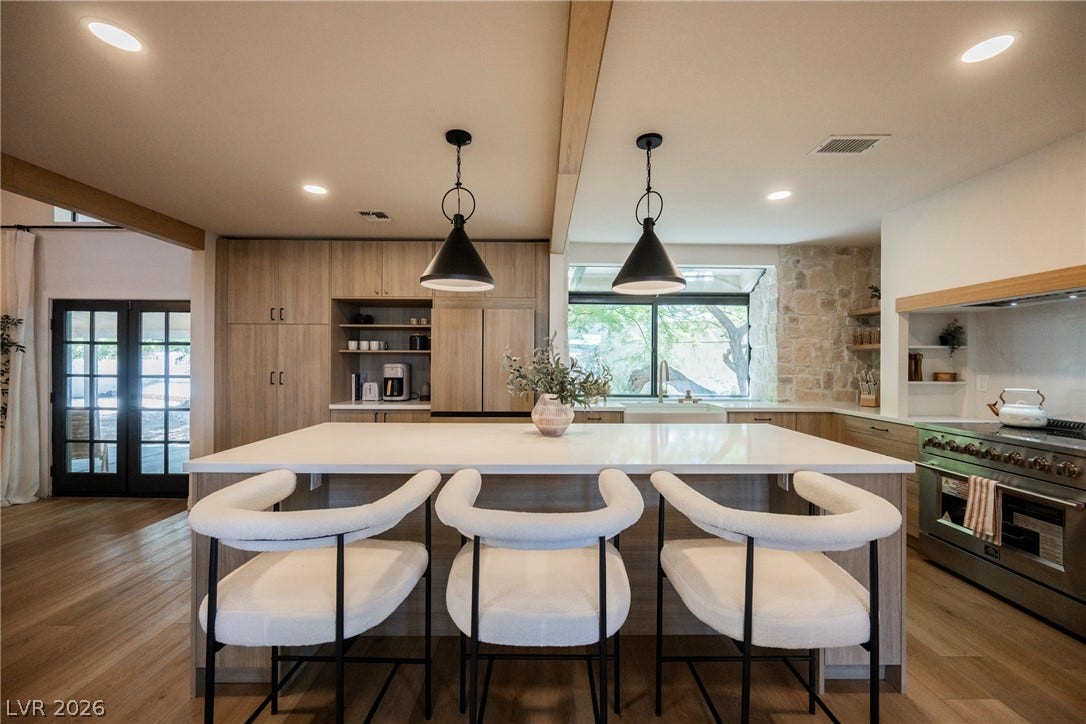 5741 S Pearl Street, Las Vegas, NV 89120 Exposed ceiling beams and rich wood flooring anchor this spacious culinary workspace.