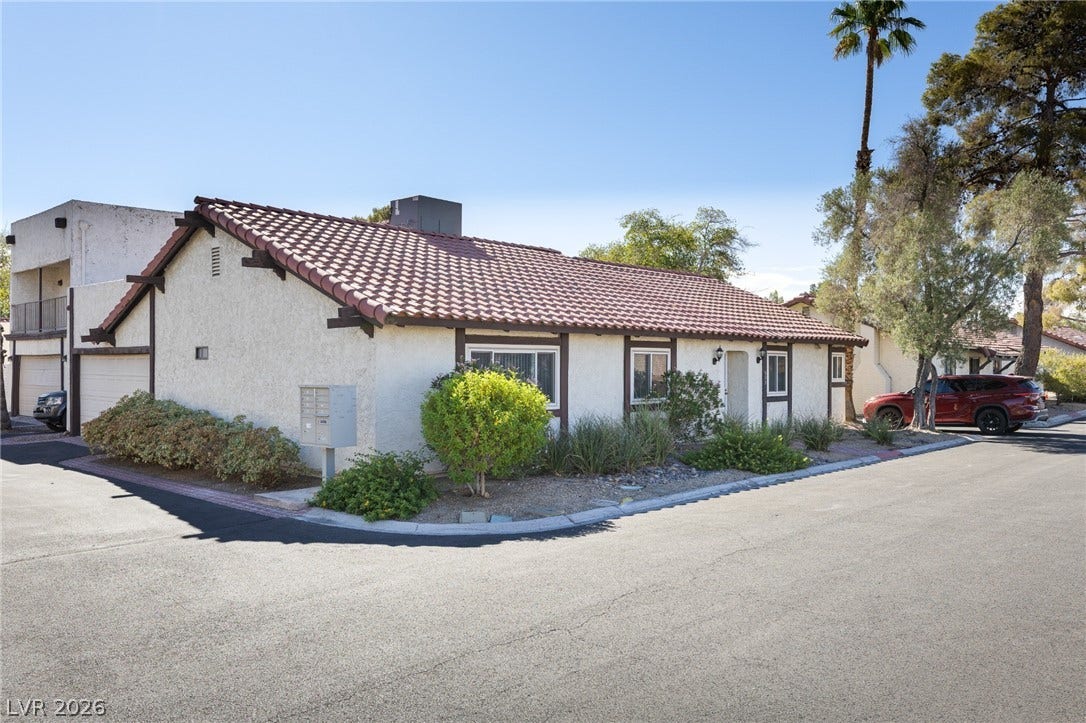 817 Spyglass Lane, Las Vegas, NV 89107 A classic tiled roof and stucco exterior define this charming corner-lot home.