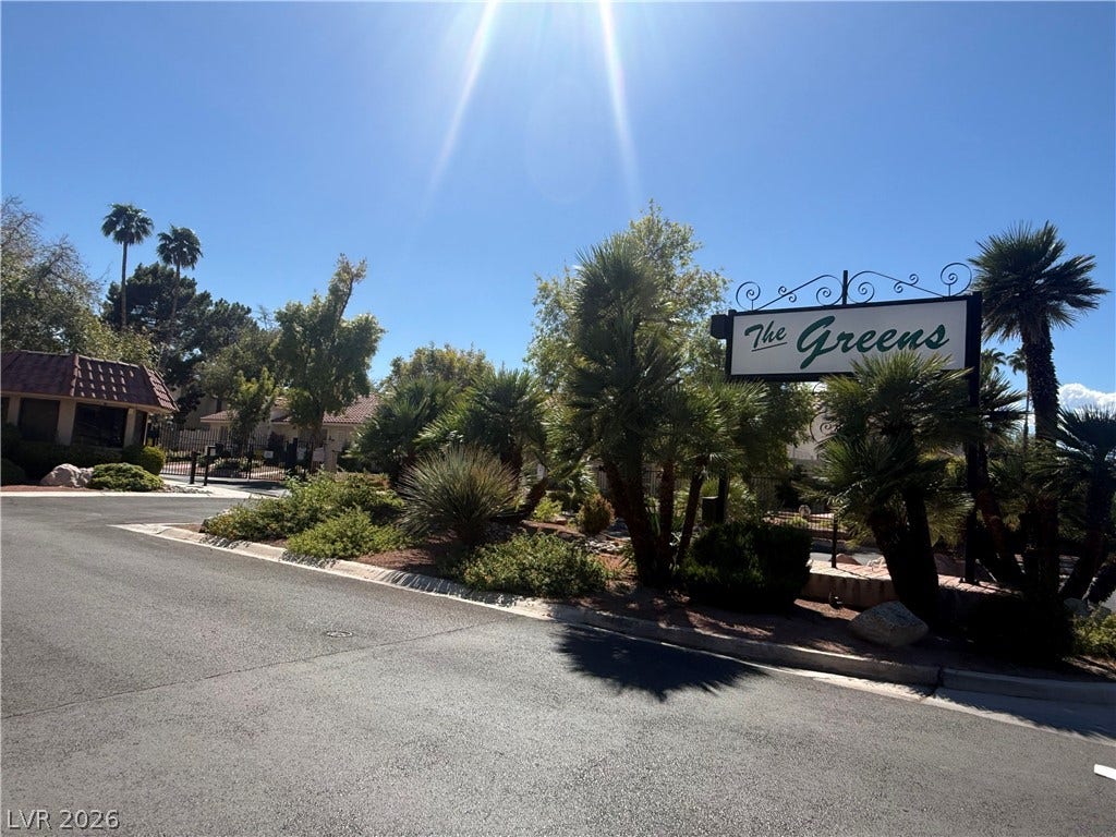 817 Spyglass Lane, Las Vegas, NV 89107 Lush desert landscaping welcomes residents at the gated entry of this community.