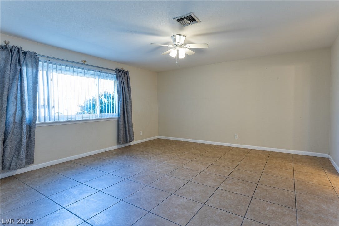 817 Spyglass Lane, Las Vegas, NV 89107 Durable tile flooring and a wide window create a versatile foundation for this space.