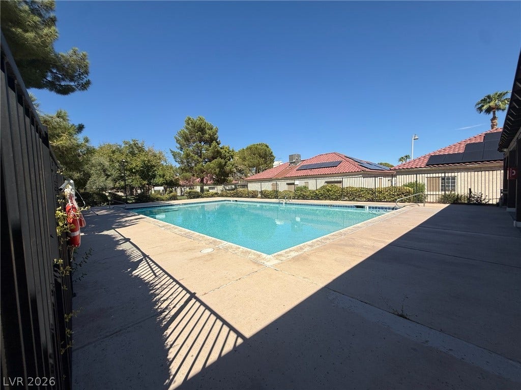 817 Spyglass Lane, Las Vegas, NV 89107 An inviting swimming pool is enclosed by secure fencing.