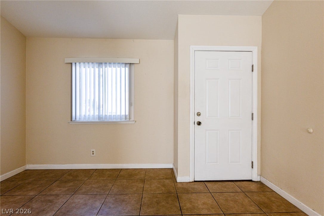 817 Spyglass Lane, Las Vegas, NV 89107 Tiled flooring and neutral walls define this functional entry space.
