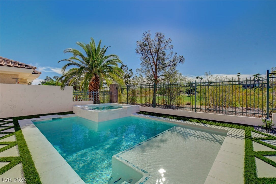 1900 Glenview Drive, Las Vegas, NV 89134 An inviting backyard oasis features a clean-lined geometric pool and raised spa overlooking a golf course.
