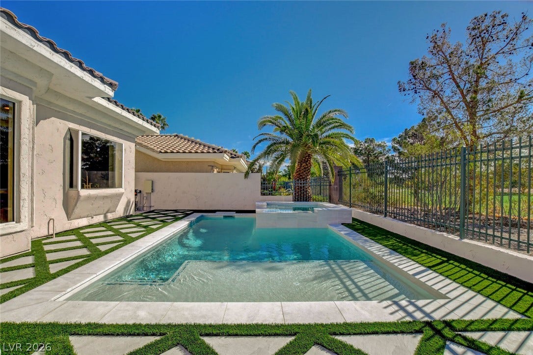 1900 Glenview Drive, Las Vegas, NV 89134 An inviting swimming pool and spa are set within a neatly manicured stone-paved yard.