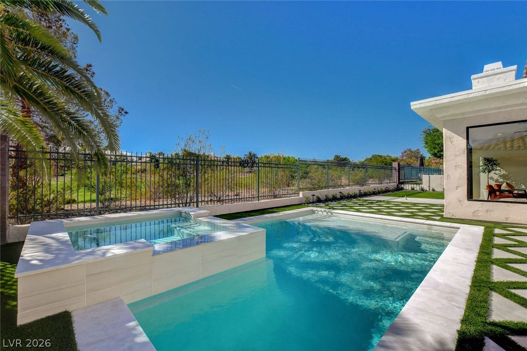 1900 Glenview Drive, Las Vegas, NV 89134 An inviting swimming pool and spa are set against a manicured geometric lawn.