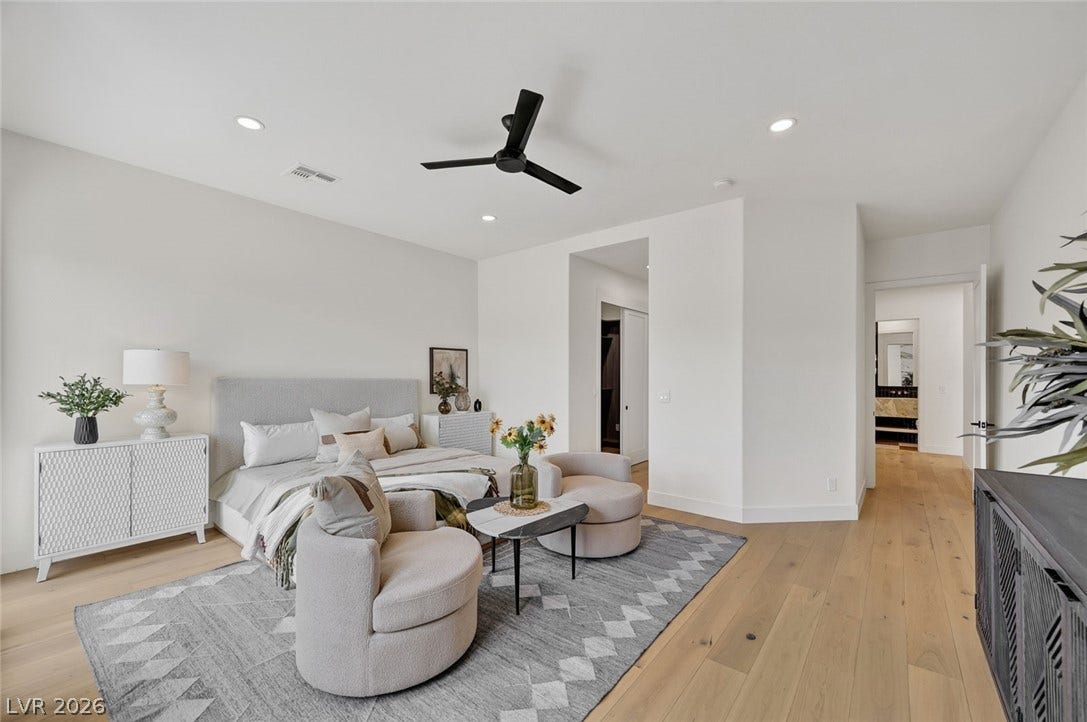 1900 Glenview Drive, Las Vegas, NV 89134 Smooth wood floors and recessed lighting anchor this airy bedroom retreat.