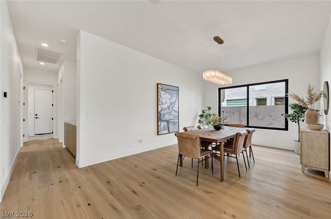 1900 Glenview Drive, Las Vegas, NV 89134 Fine wood flooring and large windows elevate this contemporary dining space.