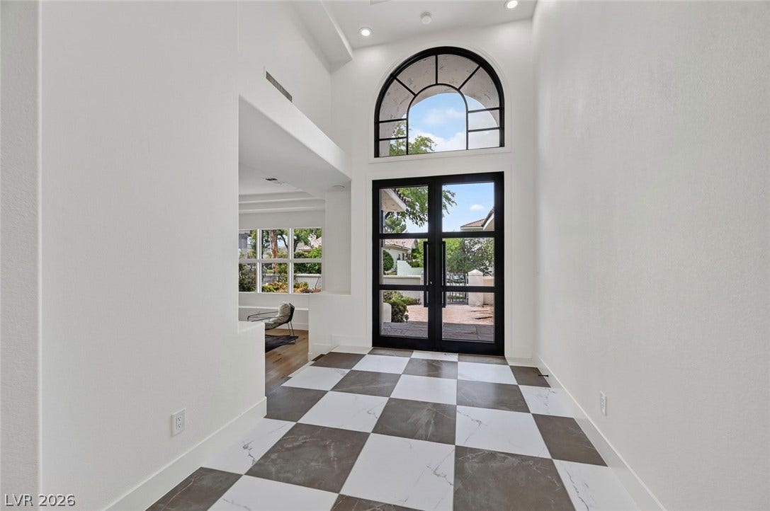 1900 Glenview Drive, Las Vegas, NV 89134 Dramatic checkered tile floors and soaring ceilings define this striking home entrance foyer.