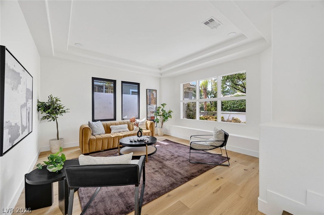 1900 Glenview Drive, Las Vegas, NV 89134 Multi-tier tray ceilings and wide windows define this airy architectural space.