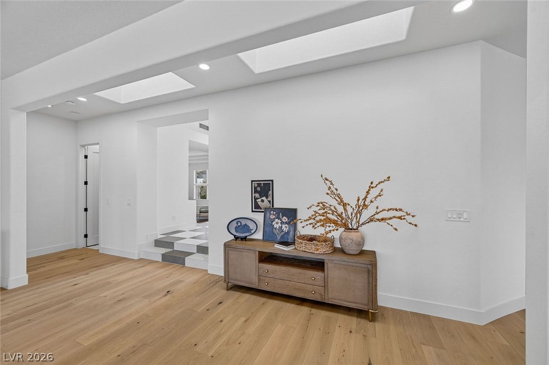 1900 Glenview Drive, Las Vegas, NV 89134 Warm hardwood floors contrast beautifully with crisp white walls and architectural skylights overhead.