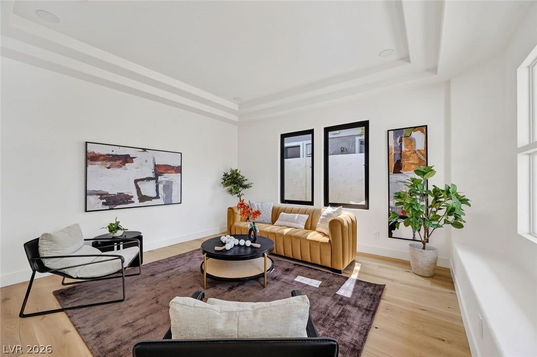 1900 Glenview Drive, Las Vegas, NV 89134 Multi-layered tray ceilings and light wood floors create a highly polished living space.