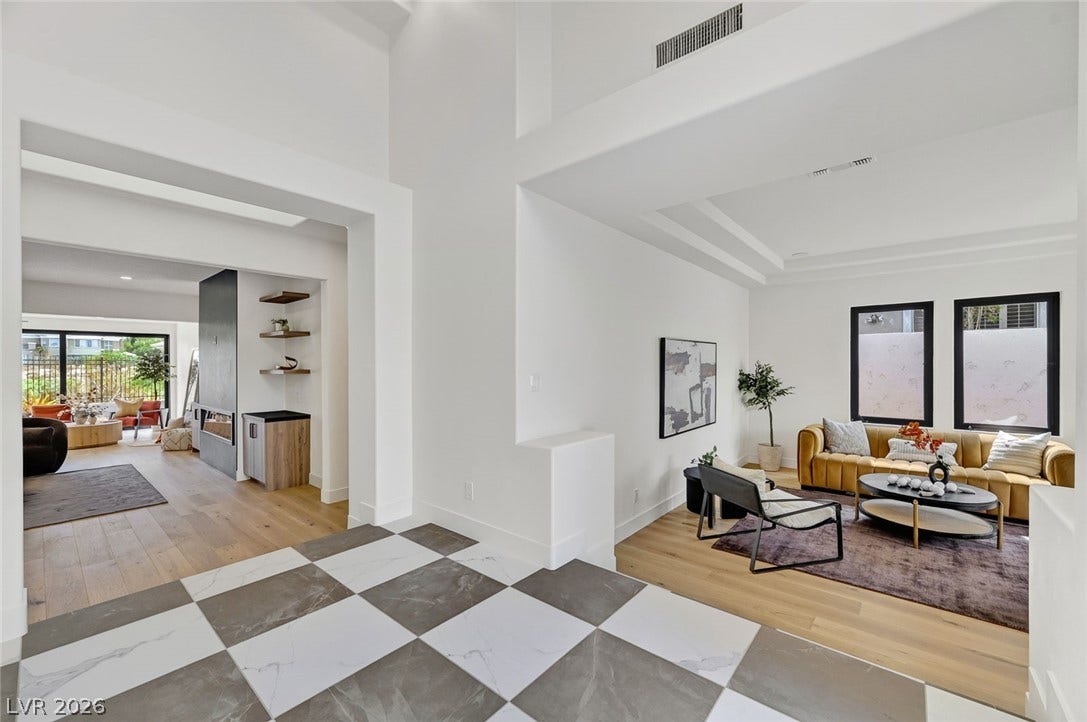 1900 Glenview Drive, Las Vegas, NV 89134 An inviting entrance foyer reveals geometric tile flooring and transitions seamlessly into the airy living spaces.
