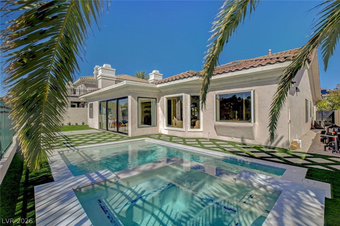 1900 Glenview Drive, Las Vegas, NV 89134 A geometric pool and integrated spa sit alongside the modern plaster exterior.