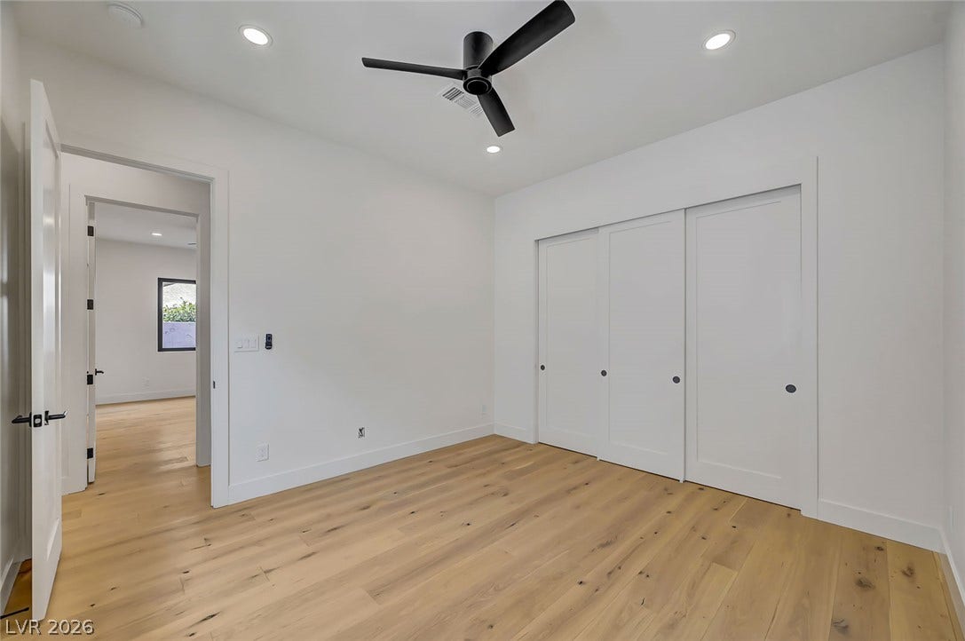 1900 Glenview Drive, Las Vegas, NV 89134 Gleaming hardwood floors and a massive sliding closet system anchor this versatile secondary bedroom.