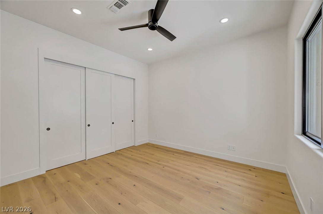 1900 Glenview Drive, Las Vegas, NV 89134 Gleaming hardwood floors and clean plaster walls define this versatile interior space.