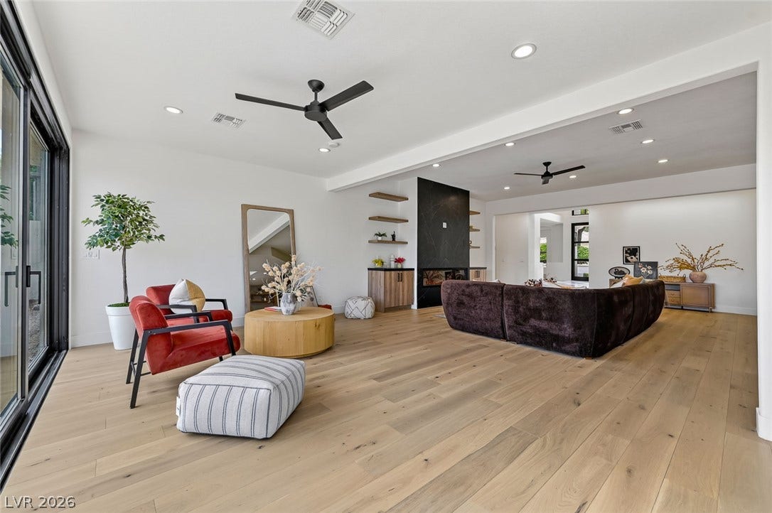 1900 Glenview Drive, Las Vegas, NV 89134 An open-concept living area anchors the home with wide-plank wood flooring and recessed lighting.
