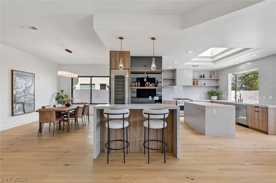 1900 Glenview Drive, Las Vegas, NV 89134 Gleaming hardwood floors and a skylight illuminate this seamlessly integrated kitchen and dining space.