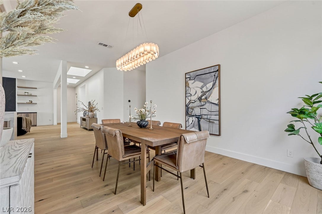 1900 Glenview Drive, Las Vegas, NV 89134 An open dining area showcases light hardwood flooring beneath clean white walls.