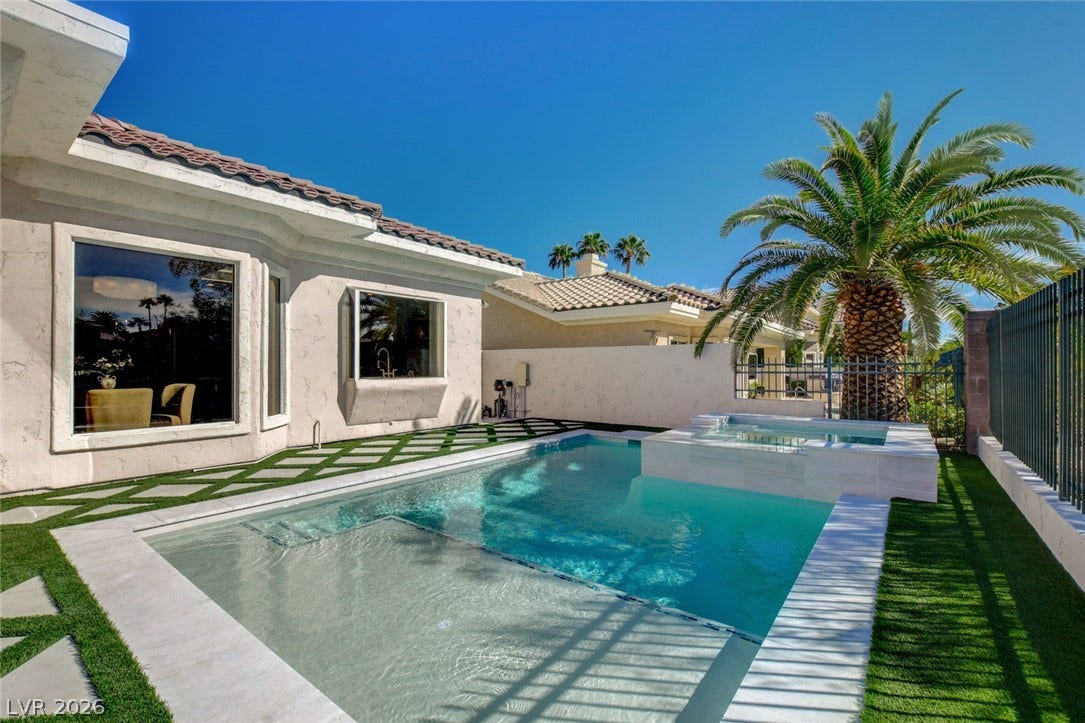 1900 Glenview Drive, Las Vegas, NV 89134 A pristine swimming pool and elevated spa highlight this beautifully manicured desert backyard oasis.