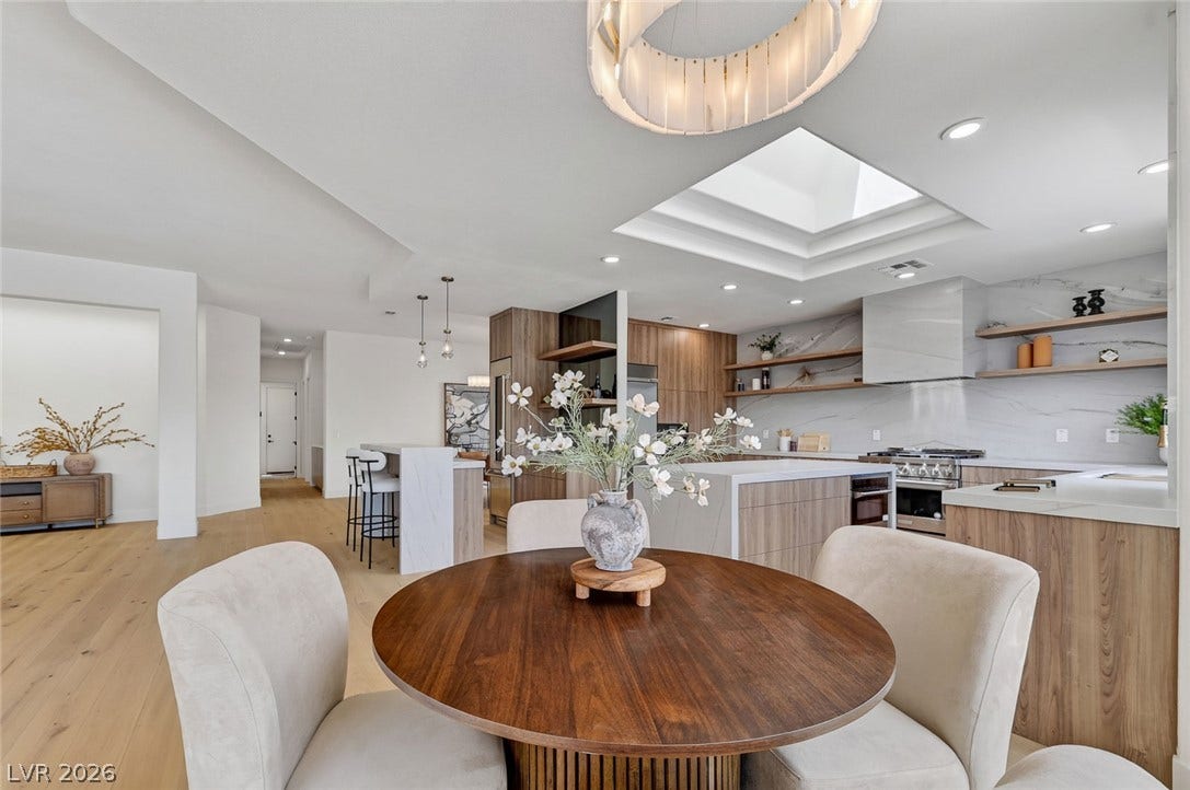 1900 Glenview Drive, Las Vegas, NV 89134 A skylight filters natural illumination down into this modern open-concept kitchen and dining area.