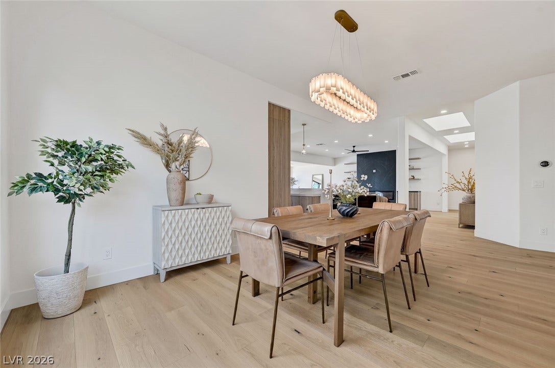 1900 Glenview Drive, Las Vegas, NV 89134 An open floor plan flows seamlessly from the dining area across warm hardwood flooring.