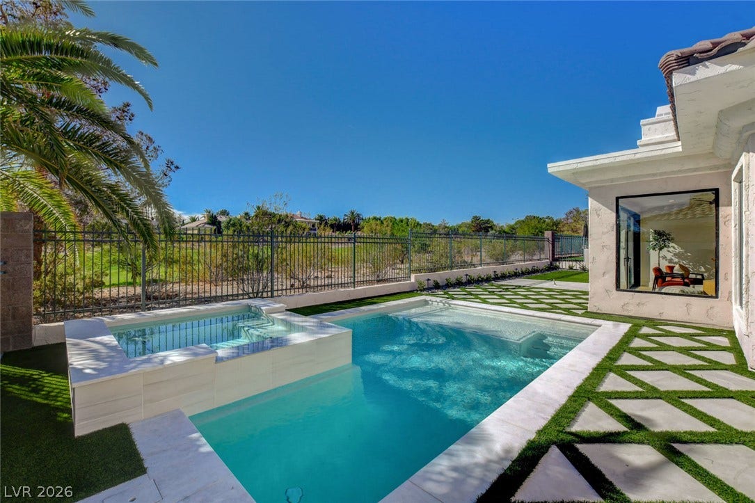1900 Glenview Drive, Las Vegas, NV 89134 A sparkling pool and spa frame the manicured backyard alongside sweeping golf course views.