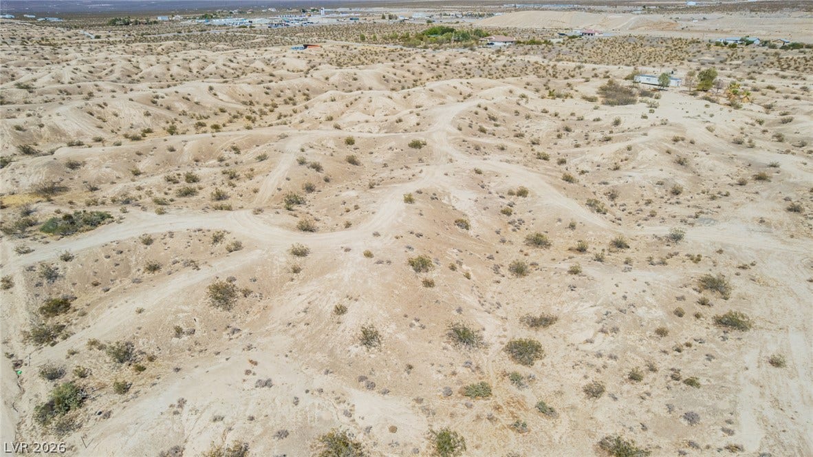 1621 Rockafeller Drive, Pahrump, NV 89060 Rolling sandy terrain and desert vegetation stretch across this expansive high-desert lot.