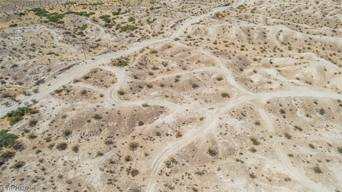 1621 Rockafeller Drive, Pahrump, NV 89060 Rolling desert topography and natural terrain define this expansive acreage.