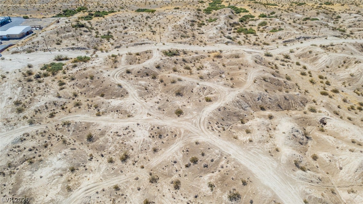 1621 Rockafeller Drive, Pahrump, NV 89060 Expansive desert acreage features rolling topography and native vegetation under vast open skies.