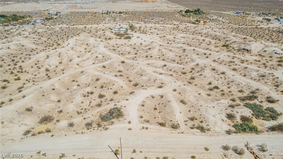1621 Rockafeller Drive, Pahrump, NV 89060 Rugged desert terrain stretches across this expansive parcel with rolling hills and natural desert vegetation.