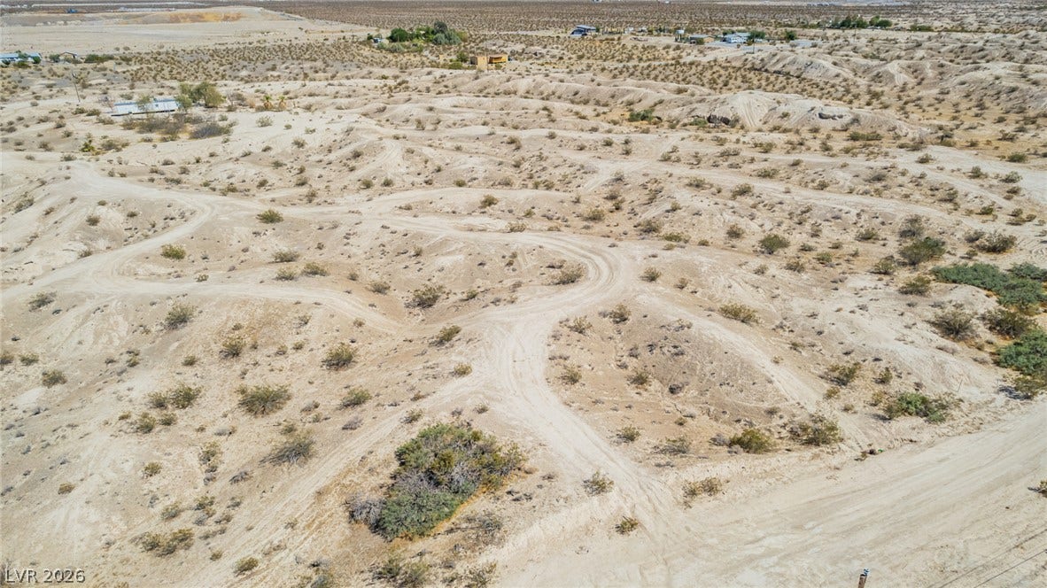 1621 Rockafeller Drive, Pahrump, NV 89060 Dirt tracks wind through the natural desert landscape of this expansive property.