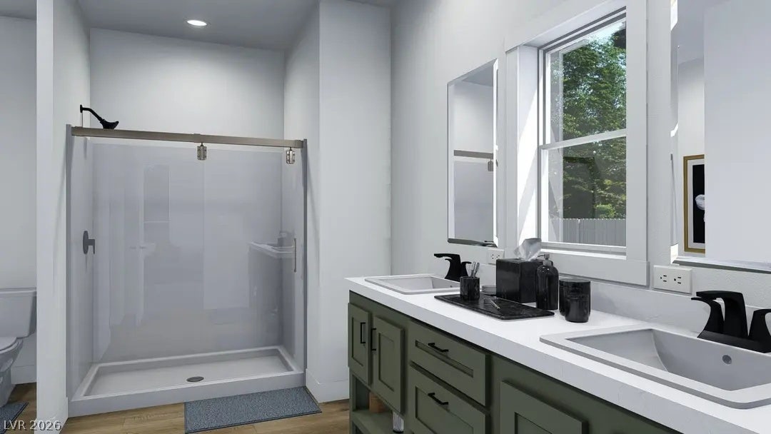 466 Box Canyon Road, Alamo, NV 89001 Clean lines and a double vanity define this modern bathroom space.