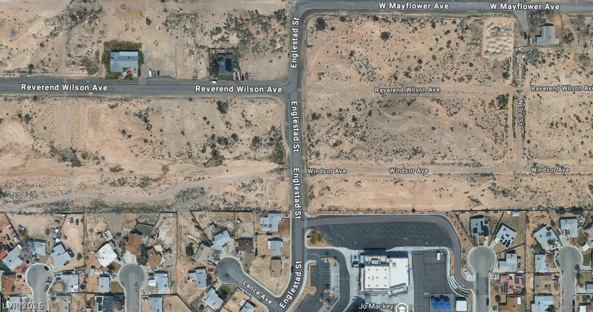 An aerial perspective shows the surrounding neighborhood layout and nearby streets.