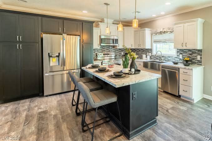 472 Box Canyon Road, Alamo, NV 89001 Premium stone countertops and a spacious central island anchor this modern dual-tone kitchen.